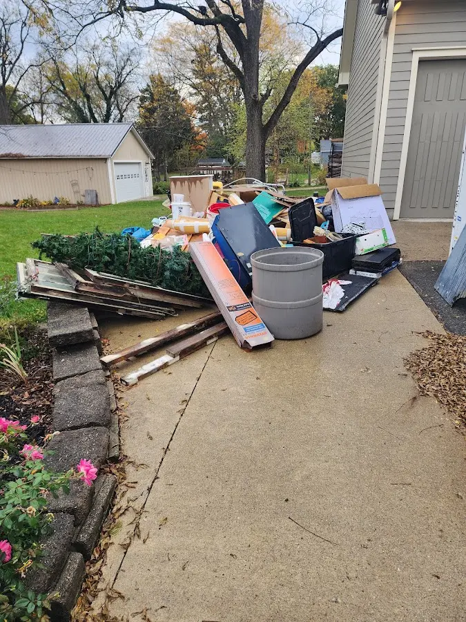 Dumpster being loaded with debris for 30 Yard Dumpster Rental in Green Lake